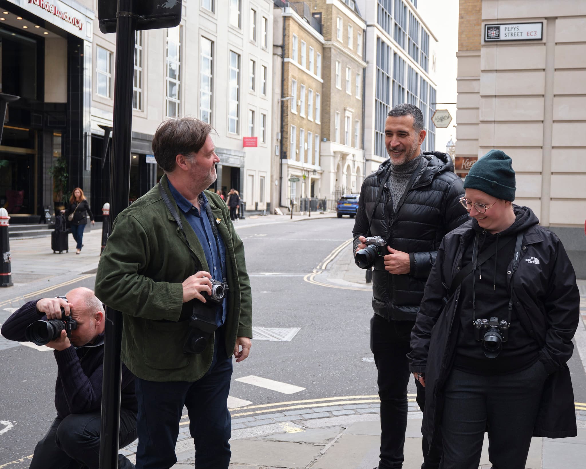 Participant reviewing a camera during a Combat 2 Camera workshop