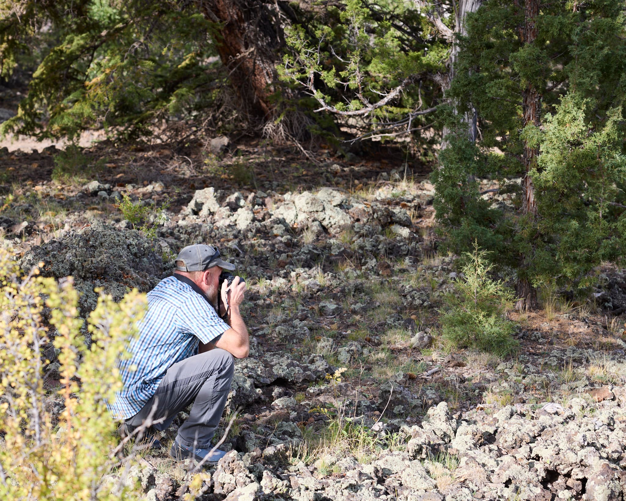 A Combat 2 Camera participant composing a photograph during a guided session